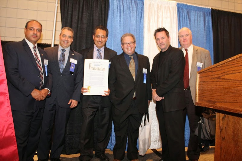 Maqsood Malik accepts a Proclamation from the Mayors Office at the NY Build EXPO